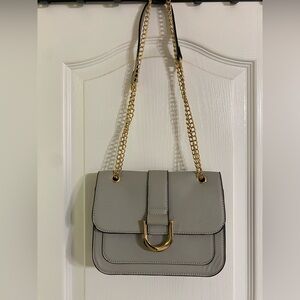 gray and gold purse